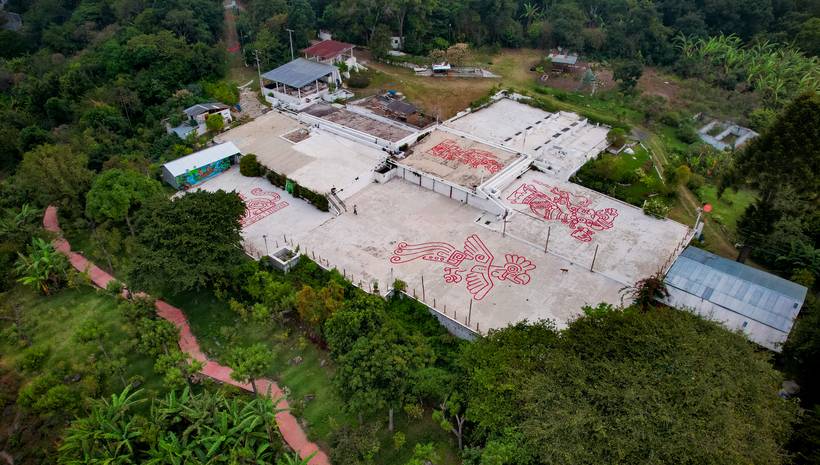 Aerial view of the patios and the red path down to the lake